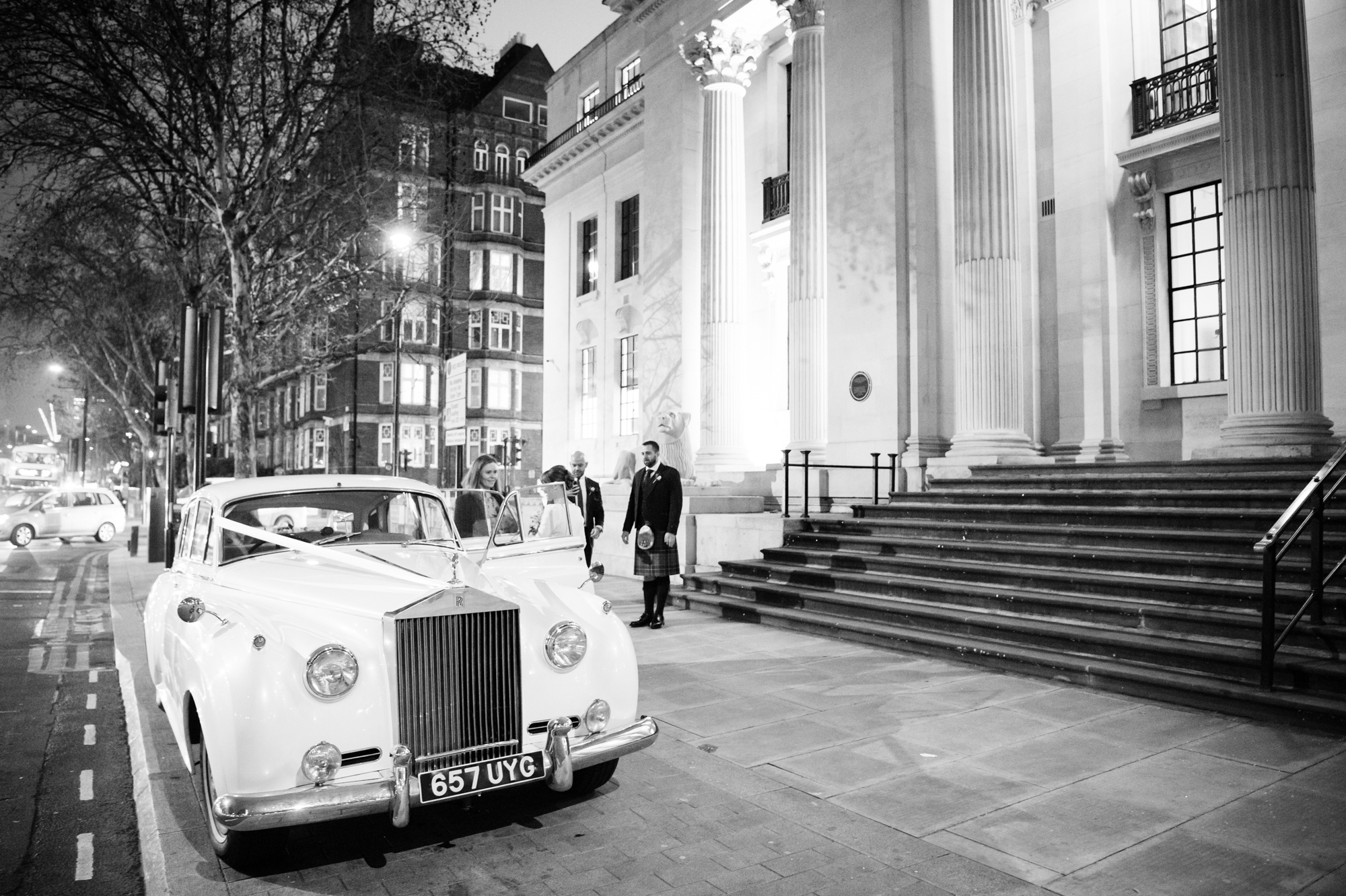 A vintage white car outside the steps of Marylebone Town Hall